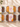 Six packaged loaves on a light stone surface with white blossoms: two almond banana bread, two lemon coconut cake, one almond pumpkin bread and one chocolate coconut cake, gluten free, grain free, dairy free, sincerely, BY PARYANI