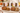 Almond banana bread and almond pumpkin bread, packaged and sliced on a marble counter with fall pumpkins, gluten free, grain free, dairy free, sincerely, BY PARYANI